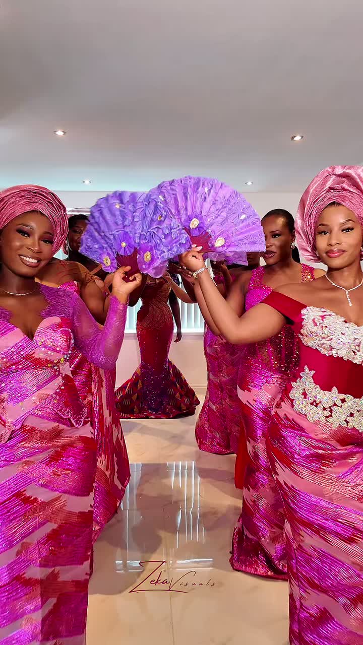 A bride entering a traditional wedding ceremony to a crowd of guests
